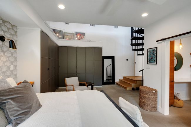 Primary bedroom with custom built-in storage and high ceilings | Image 17