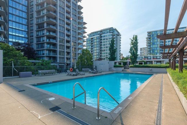 Pool featuring a patio area, fence, and a city view | Image 24
