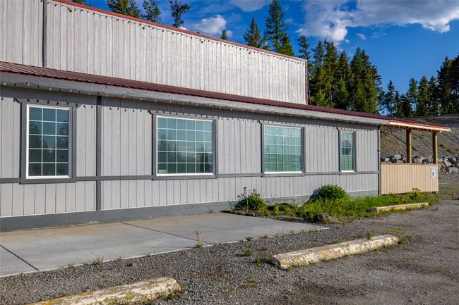 View of side of property with metal roof and a patio area | Image 115