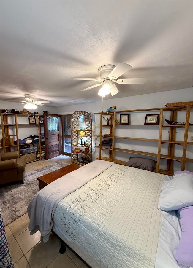 Bedroom with a textured ceiling | Image 24