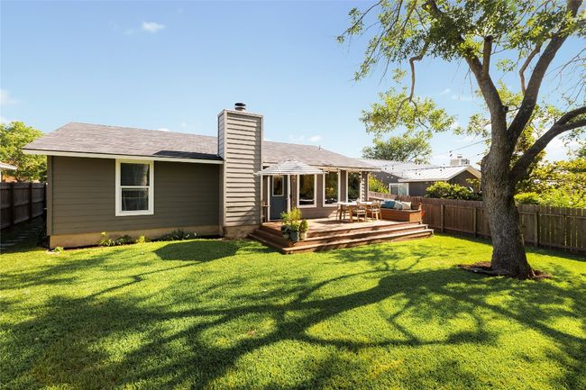 Gorgeous backyard with plenty of rom to enjoy, privacy fencing and shade tree. | Image 36
