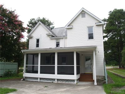 Screened porch compliments rear of home. | Image 3