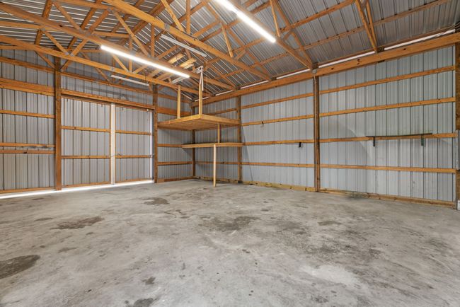 Garage featuring metal wall | Image 34