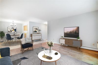 Living Room With On Trend Flooring And So Much Natural Light. Virtually Staged | Image 2