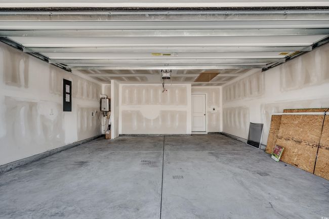 Garage featuring a garage door opener | Image 29