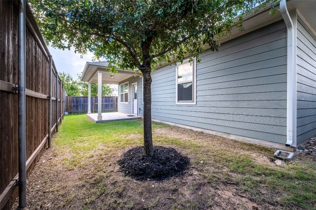 Fenced backyard featuring a patio area | Image 8