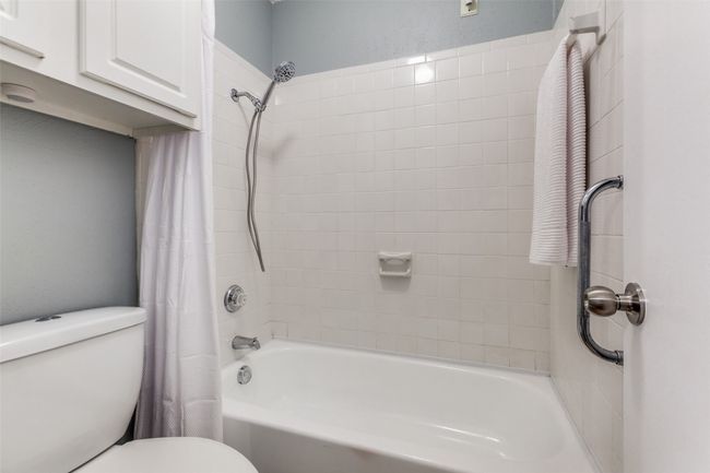 Bathroom with shower / bath combo and toilet | Image 24