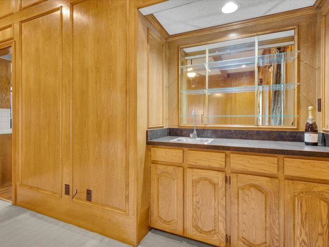 Wet bar with working water and cabinets. | Image 12