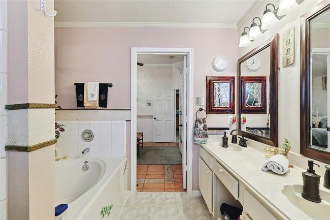 Closer view of the relaxing soaking tub, with a spacious walk-in shower just steps away — combining comfort with everyday convenience. | Image 16