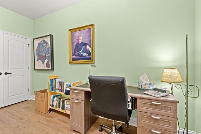 Home office with baseboards and light wood-type flooring | Image 4