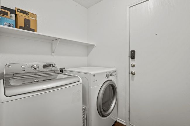 Laundry room with washer and clothes dryer | Image 17