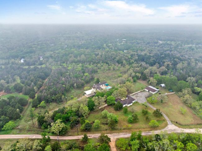 Birds eye view of property with a view of trees | Image 40