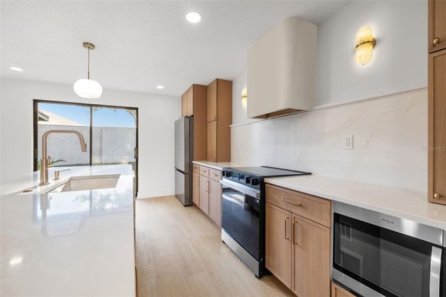 1052 Concord Dr W, House other with 3 bedrooms, 2 bathrooms and null parking in Dunedin FL | Image 6