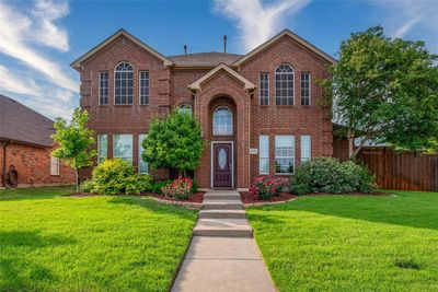 Welcome home to a fully landscaped yard and great curb appeal. | Image 1