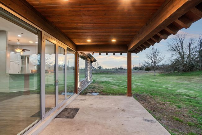 Patio terrace at dusk featuring a yard | Image 36