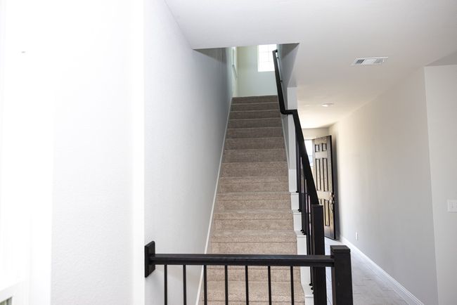 Stairs featuring baseboards and wood finished floors | Image 4