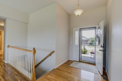 The storm door which was added to the primary entrance adds an abundance of natural light to the living area. | Image 3