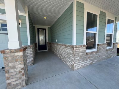 View of exterior entry with a porch | Image 2