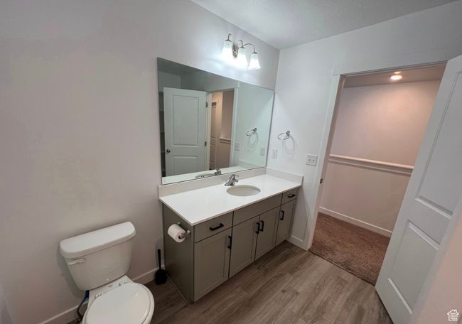 Bathroom with wood finished floors and vanity | Image 20