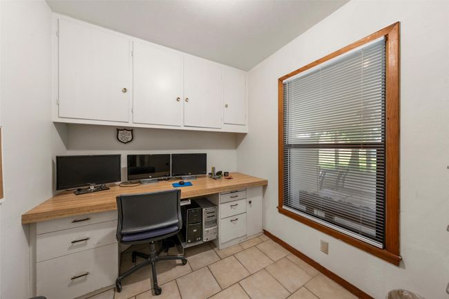 Home office featuring built in desk | Image 16