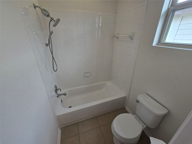 Full bath with tile patterned floors and bathing tub / shower combination | Image 26