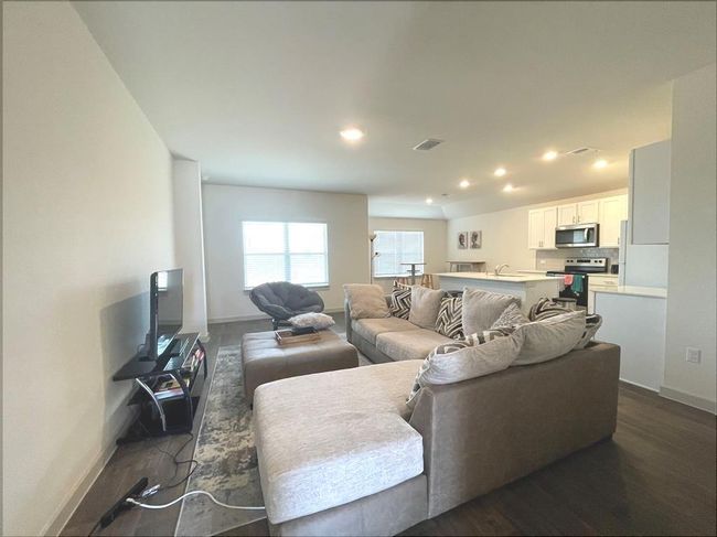 Living room featuring baseboards, recessed lighting, and dark wood-style flooring | Image 7