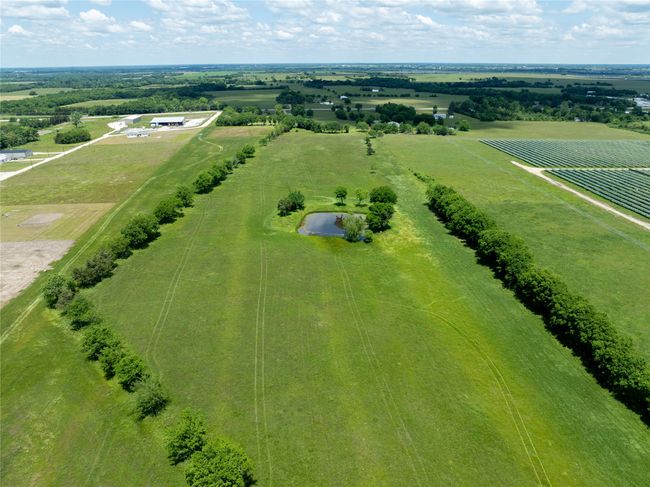 Overview of rural landscape featuring large plots for crops | Image 6