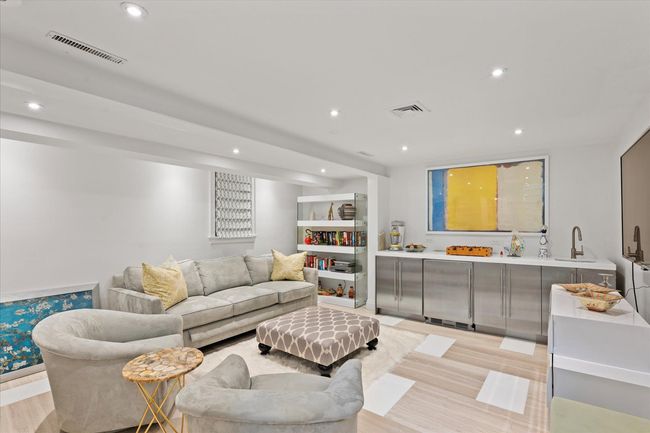 Living room featuring light wood finished floors and recessed lighting | Image 20