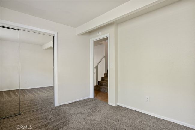 Mirrored closet doors in bedroom | Image 22
