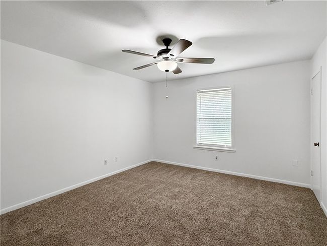Empty room with carpet flooring and a ceiling fan | Image 10