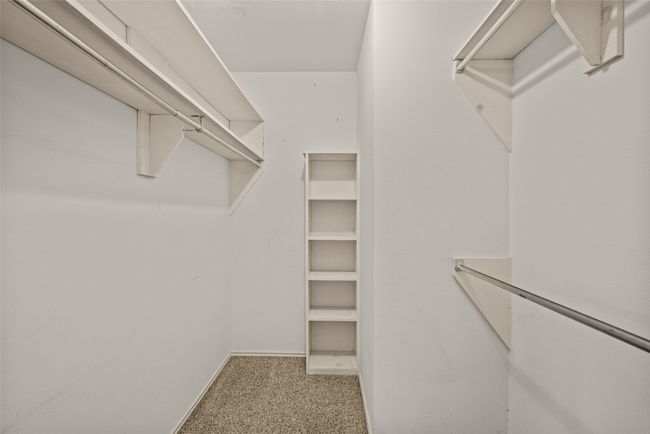 Spacious closet featuring carpet floors | Image 17