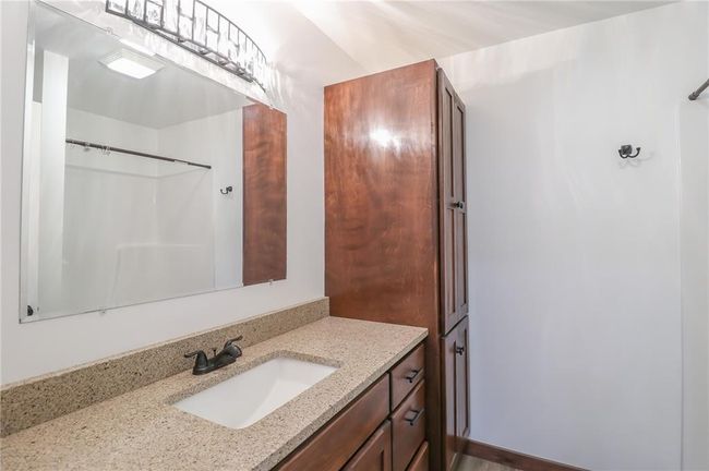 Bathroom with walk in shower and vanity | Image 30