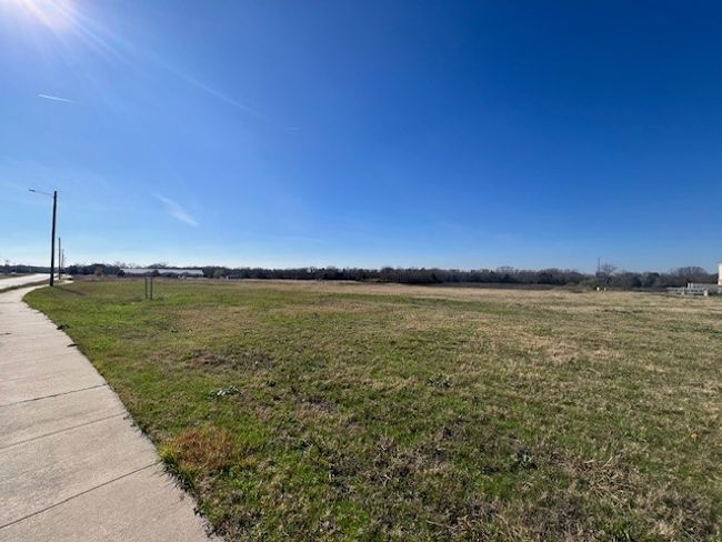 View of grassy yard with a rural view | Image 5
