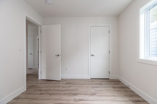 Unfurnished bedroom featuring light wood finished floors and baseboards | Image 24