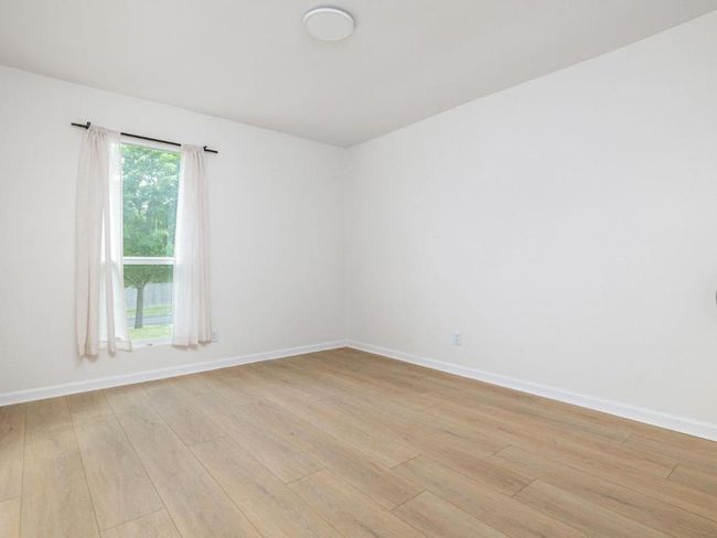Unfurnished room featuring light wood-type flooring and baseboards | Image 19