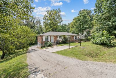 Paved drive with concrete parking area and plenty of back parking | Image 2