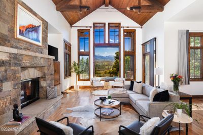 Main level living area with views of NY Mountain and gas fireplace | Image 1