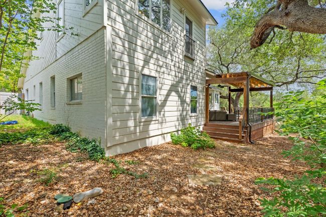 View of side of home featuring a pergola and brick siding | Image 35