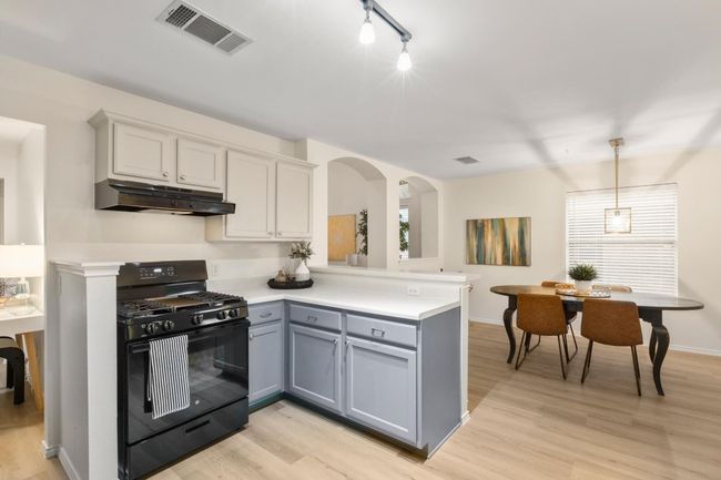Freshly painted cabinets give this kitchen a pop of interest. | Image 11