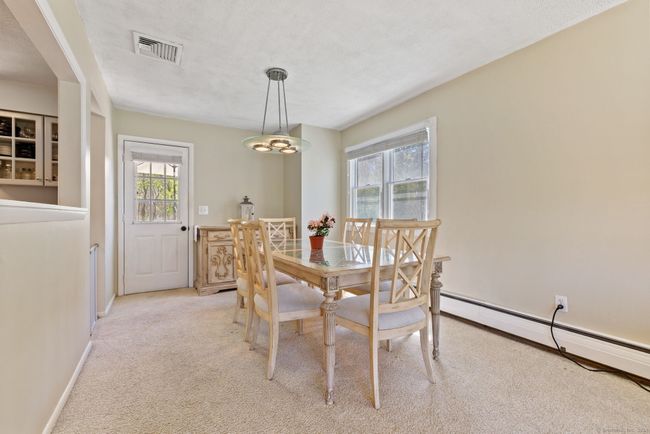 dining room off kitchen with door to deck | Image 10
