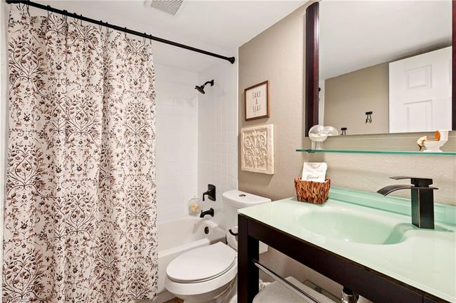 Bathroom with vanity and shower / bath combination with curtain | Image 22