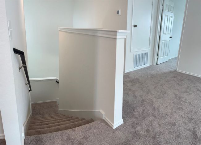 Staircase with carpet and baseboards | Image 21