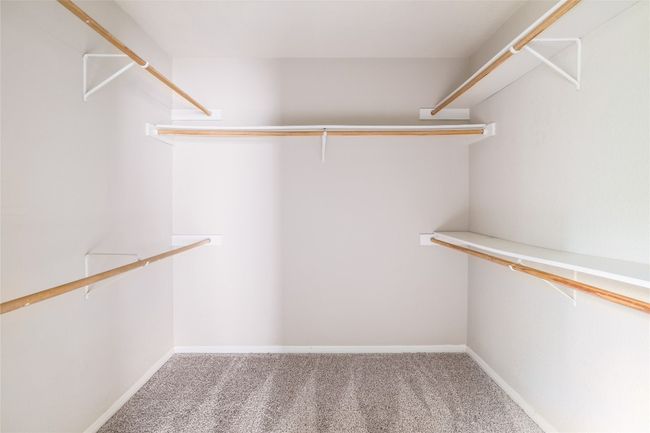 Walk in closet featuring carpet flooring | Image 15