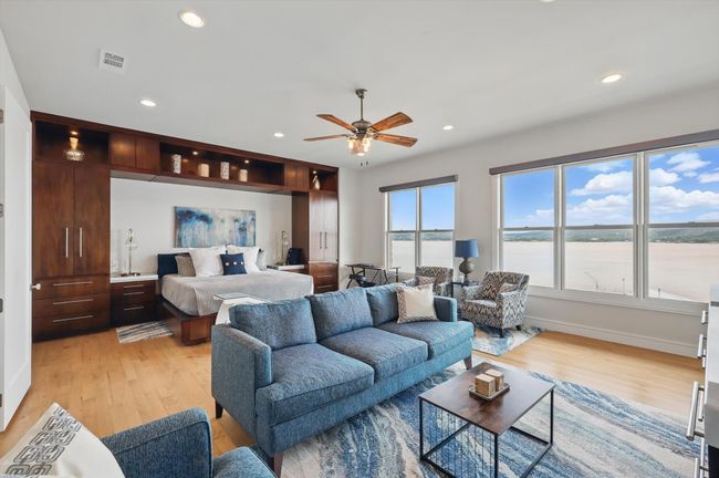 Bedroom with light wood-style floors, recessed lighting, and visible vents | Image 28