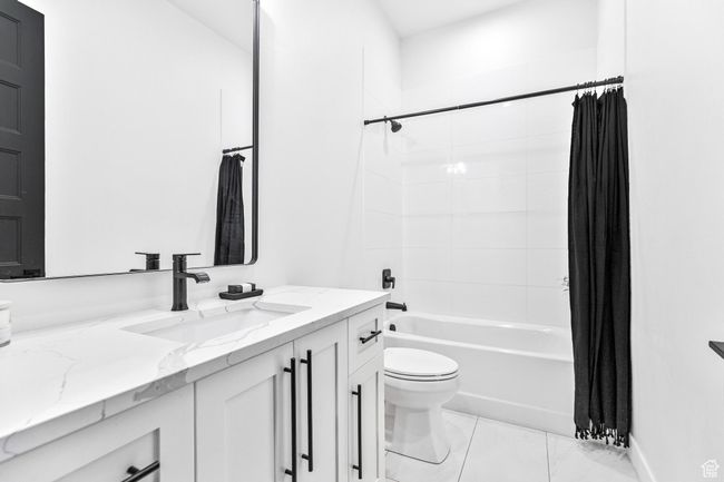 Bathroom with shower / tub combo, toilet, and vanity | Image 45