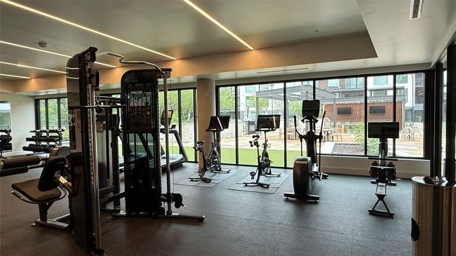 Gym featuring plenty of natural light | Image 32