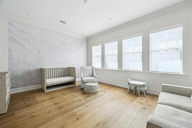 The generously sized secondary bedrooms in this exceptional home are bathed in natural light, each offering a luxurious en-suite, spacious walk-in closet, and elegant white oak hardwood floors. | Image 20