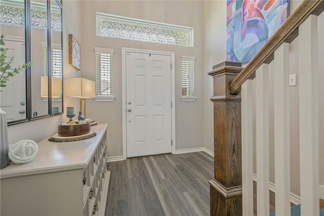 Entrance foyer with wood finished floors and baseboards | Image 4