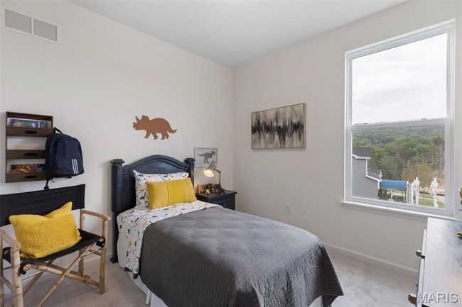 Carpeted bedroom with baseboards | Image 7
