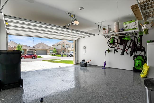 Garage with a residential view and a garage door opener | Image 24